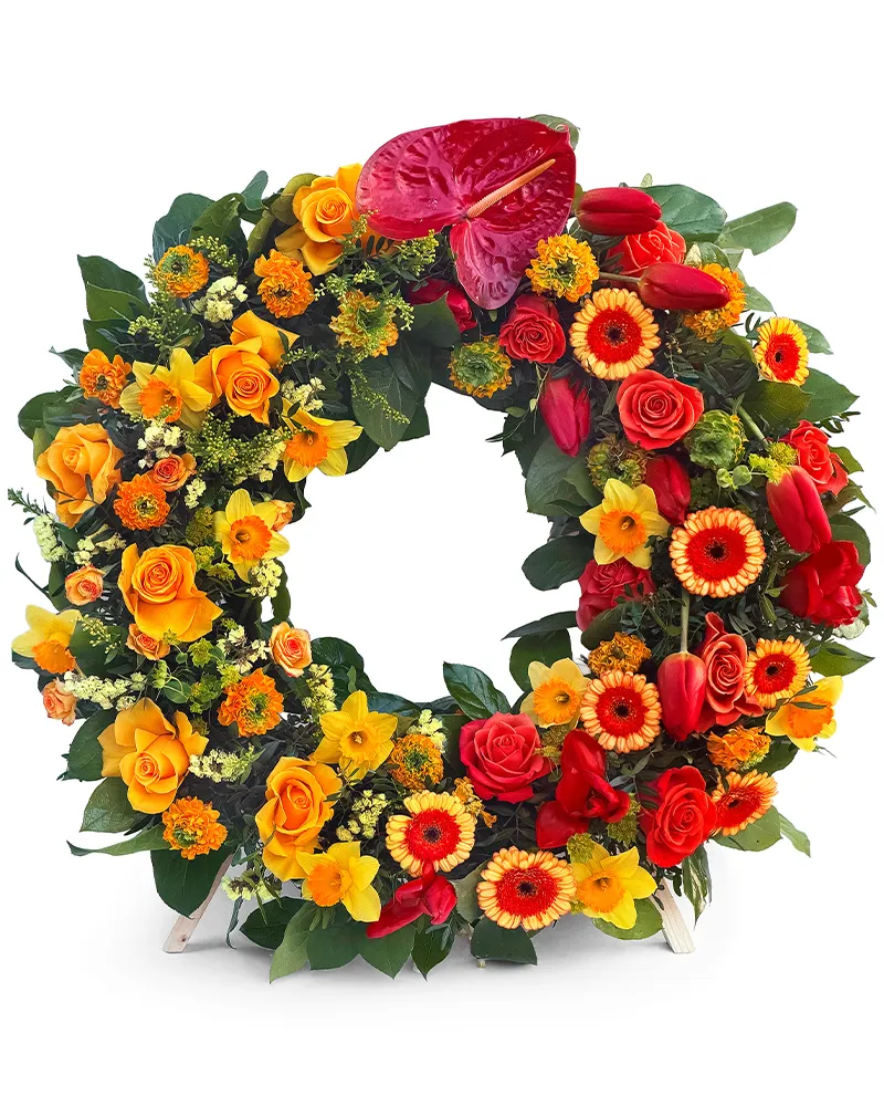 Coroana funerara rotunda cu trandafiri portocalii, anthurium rosu, minigerbera, lalele si ranunculus